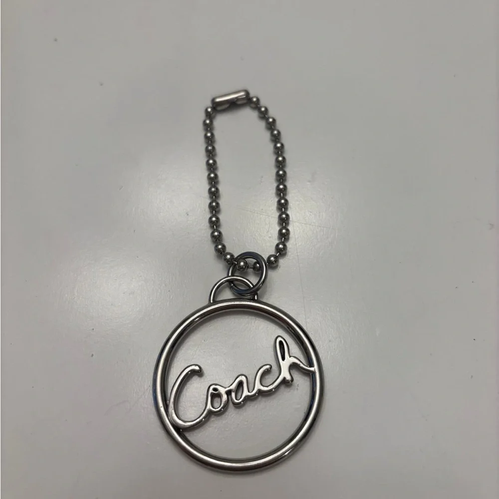 Coach round silver script spellout metal hang tag purse charm chain